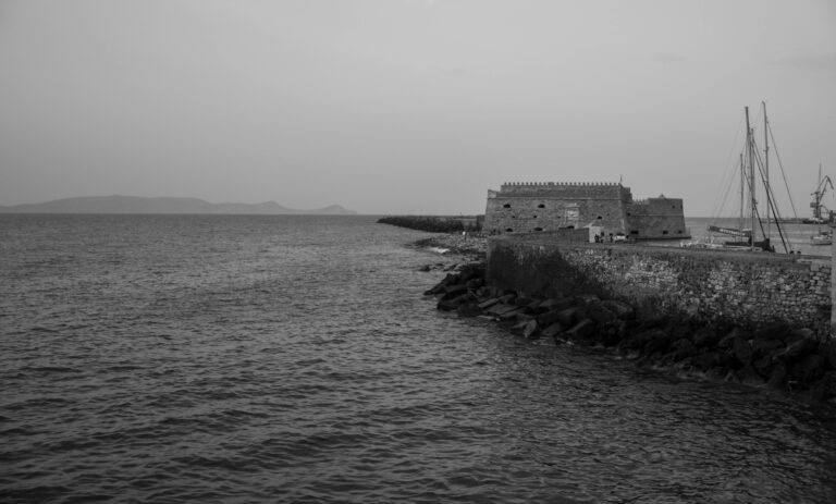 koules fortress beside the sea at greyscale